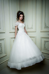 Fototapeta premium gorgeous bride in luxury wedding dress. Wedding make up and hairstyle, wedding jewelry.