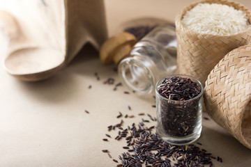 Mixed rice and Rice berry or uncooked brown rice in wooden spoon