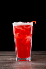 Rose coctail with ice on black background