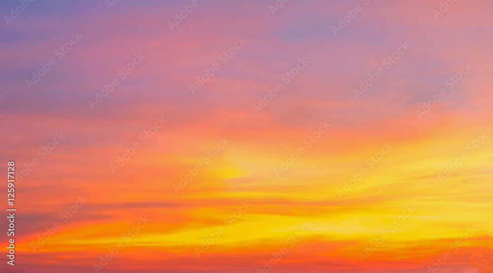 Wall mural Bright orange and yellow colors dramatic sunset sky,sunrise sky,soft focus