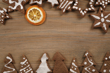 gingerbread chocolate cookies over wood table forms composition