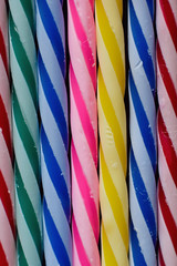 Macro background texture colorful lined up birthday cake candles