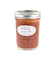 Canned homemade ghost pepper sriracha sauce