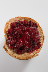 Roasted bread with layer of black currant jam
