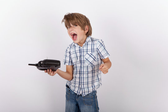 Cheerful boy with a drone remote control