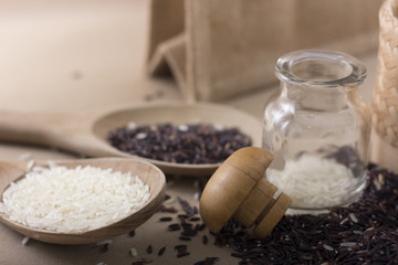 Mixed rice and Rice berry or uncooked brown rice in wooden spoon