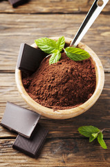 Dark chocolate and cacao on the wooden table
