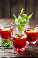 Aperitif with campari, mint and lemon