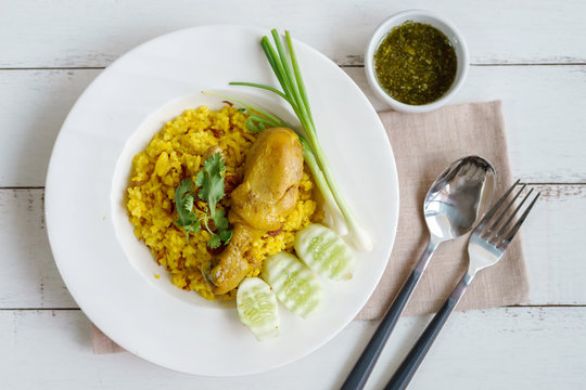 Close up of chicken biryani yellow curry rice