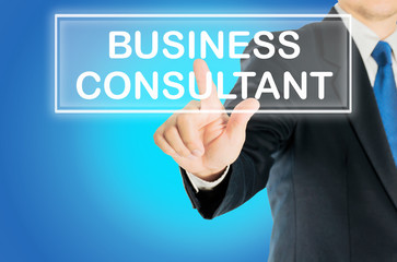 Business man is pushing BUSINESS CONSULTANT transparent button word over blue gradient background, business concept