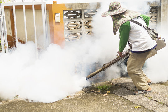 Man is using thermal fog machine to protect mosquito spreading