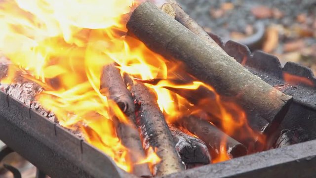 fire wood for barbecue charcoal Slow Motion Closeup of a warm fire burning in a campfire