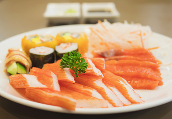 Fresh colorful Japanese food on the white plate, selective focused