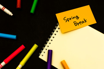 Spring Break; A Sketchbook and pens on Black Background