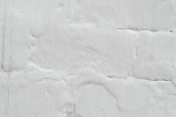 Wall fragment with scratches and cracks