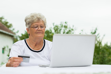 Grandmother buying online with credit card