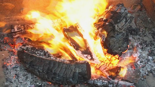fire wood for barbecue charcoal Slow Motion Closeup of a warm fire burning in a campfire