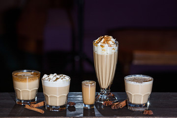different coffee drinks on a dark background