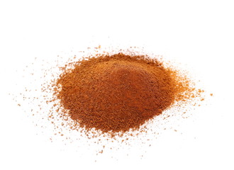 Heap of ground Cinnamon isolated on white