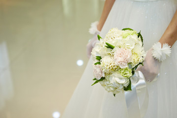 Bride holding wedding bouquet 