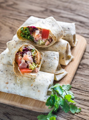 Chicken burritos on the wooden background