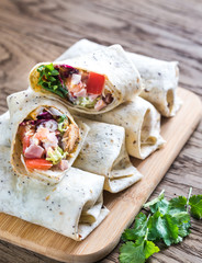 Chicken burritos on the wooden background