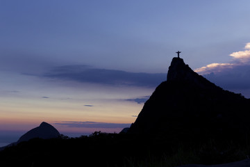 Christ the Redeemer Statue on top of Corcovado hill in the evening sunlight, Rio de Janeiro, Brazil.