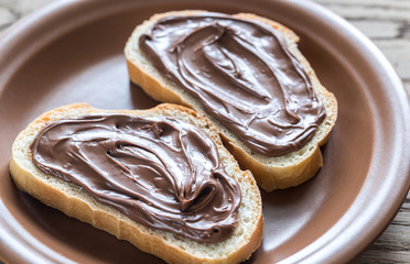 Slices of baguette with chocolate cream