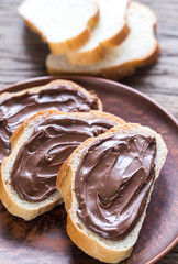 Slices of baguette with chocolate cream
