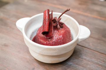 Pear poached in red wine sauce

