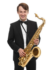 Fototapeta na wymiar Attractive saxophonist with a saxophone in a suit.