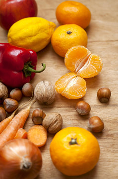 mixed fruit and vegetables on a wooden table