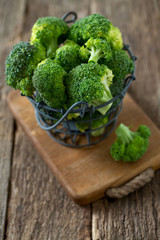 fresh broccoli on wooden surface