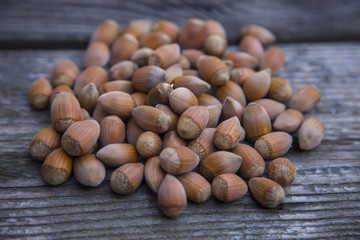 Hazelnuts on a old wooden table. Hazelnut background.
