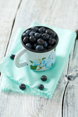 blueberry on wooden surface