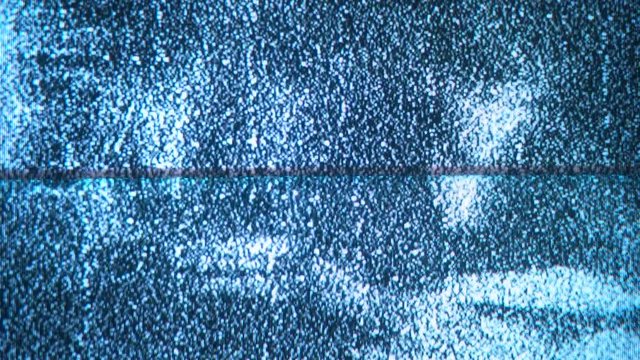A flickering, analog TV signal. VHS retro recording video cassettes, TV channels. Screen / Noise Static flicker. Noise Sound