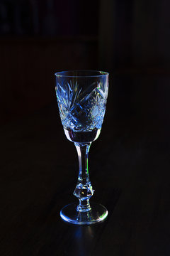 crystal wineglass on a dark background