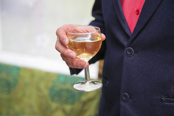 Man hold in hand glass