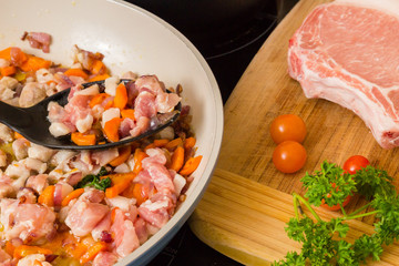 Small pieces of pork cooked in a pan