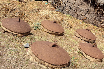 Underground silos with adobe lids. Oromia region-Ethiopia. 0528
