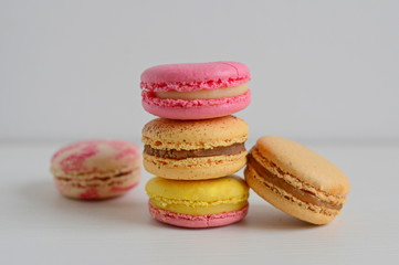 French colorful macarons with white background