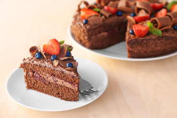 Delicious chocolate cake with strawberry on plate