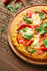 Tasty pizza on wooden table