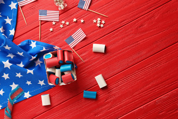 Assortment of sweets with USA flags on red wooden background