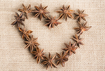 Heart inscription made from Stars anise on sackcloth
