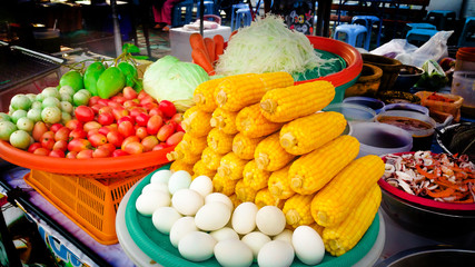 Veggies and fruits, papaya , tomato , corn , mango , salted egg , eggplant , garnish for papaya Salad Shop Popular menu in Thailand.
