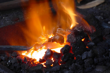 Forge with iron stick