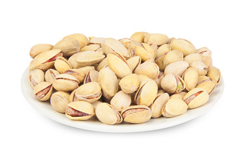 delicious pistachio nuts on  plate on  white background