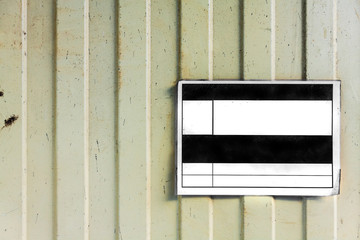 blank label on a shabby metal surface