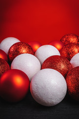red and white baubles on a black wooden table